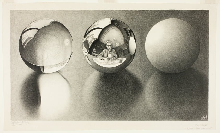 Three Spheres II es una litografía del artista holandés M. C. Escher, impresa por primera vez en abril de 1946. Como su título indica, representa tres esferas descansando sobre una superficie plana. La esfera de la izquierda es transparente, con una representación fotorrealista de la luz refractada que se proyecta a través de ella hacia el espectador y sobre la superficie plana. La esfera en el centro es reflectante. Su reflejo es una imagen autorreplicante de Escher en su estudio dibujando las tres esferas. En el reflejo se puede ver claramente la imagen de las tres esferas en el papel sobre el cual Escher está dibujando: en la esfera central de esa imagen, se puede distinguir vagamente el reflejo del estudio de Escher, que se muestra en la imagen principal. Este proceso se sugiere como infinito y recursivo. La esfera de la derecha es opaca y difusa, es decir, ni especularmente reflectante ni transparente. La pintura se encuentra en el Museo Escher en La Haya.